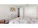 Cozy bedroom featuring a decorative dresser, queen sized bed and a closet at 2644 Slagrove Ct, Winter Garden, FL 34787