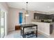Inviting dining area with contemporary lighting and access to the outdoors at 2644 Slagrove Ct, Winter Garden, FL 34787