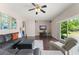 Open living room features hardwood floors, modern sofa, and sliding glass doors at 2644 Slagrove Ct, Winter Garden, FL 34787