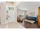 Bright living room featuring tile entry, hardwood floors, and a large window at 2644 Slagrove Ct, Winter Garden, FL 34787