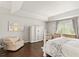 The main bedroom has a tray ceiling, hardwood floors, neutral paint, and a large dresser at 2644 Slagrove Ct, Winter Garden, FL 34787