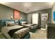 Bedroom featuring two beds with gray bedding, sconces and a modern chandelier at 3009 Penelope Loop, Kissimmee, FL 34746