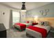 Playful bedroom with two beds and custom Disney wall decor, perfect for a magical getaway at 3009 Penelope Loop, Kissimmee, FL 34746