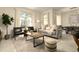 Bright living room with modern furniture, large windows overlooking pool, and stylish decor at 3009 Penelope Loop, Kissimmee, FL 34746