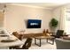 Inviting living area blending dining and living spaces, featuring modern decor, neutral tones, and ample natural light at 3009 Penelope Loop, Kissimmee, FL 34746