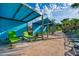 Outdoor community lounge area featuring shade and chairs for seating at 3009 Penelope Loop, Kissimmee, FL 34746
