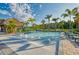 Resort-style pool featuring clear water, lounge chairs and a tiki hut for shade at 3009 Penelope Loop, Kissimmee, FL 34746
