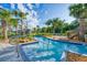 Lazy river pool featuring clear water, small fountains and a playground at 3009 Penelope Loop, Kissimmee, FL 34746
