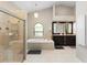 Luxurious bathroom featuring a soaking tub, walk-in shower, and dual vanities at 324 Old Mill Rd, Enterprise, FL 32725