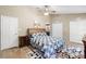Neutral primary bedroom with ceiling fan and large closets at 324 Old Mill Rd, Enterprise, FL 32725