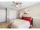 Bright bedroom features ceiling fan, closet, light wood floors and complementary decor at 324 Old Mill Rd, Enterprise, FL 32725