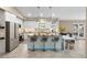 Modern kitchen with a large island, stainless steel appliances, and ample cabinet space at 324 Old Mill Rd, Enterprise, FL 32725