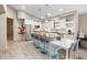 Modern kitchen with stainless steel appliances, island seating, and ample cabinet space at 324 Old Mill Rd, Enterprise, FL 32725