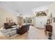Cozy living area featuring tile floors, vaulted ceilings, and natural light at 324 Old Mill Rd, Enterprise, FL 32725