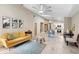 Open-concept living room with high ceilings, fan, dining area, and seamless flow to the kitchen at 324 Old Mill Rd, Enterprise, FL 32725
