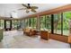Bright sunroom with large windows providing beautiful views and tile floors at 324 Old Mill Rd, Enterprise, FL 32725