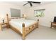Comfortable bedroom with natural light, ceiling fan, and wood-framed bed at 3317 Dormer Ct, Winter Park, FL 32792