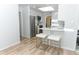 Bright kitchen with stainless appliances, breakfast bar, and white stools at 3317 Dormer Ct, Winter Park, FL 32792