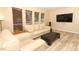 Comfortable living room with modern furniture, wood-look floors, and ample natural light at 3317 Dormer Ct, Winter Park, FL 32792