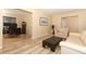 Open-concept living room featuring comfortable seating and a view into an office area at 3317 Dormer Ct, Winter Park, FL 32792