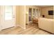 Bright living room with stylish flooring, neutral walls, and comfortable seating arrangement at 3317 Dormer Ct, Winter Park, FL 32792