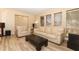 Spacious living room with stylish floors, a large sofa, and plenty of natural light at 3317 Dormer Ct, Winter Park, FL 32792