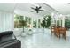 Expansive sunroom with abundant natural light, views of the pool, and a casual dining area at 3317 Dormer Ct, Winter Park, FL 32792