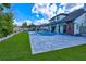 Picture of a large yard with green grass, a pool, a pergola, and a fenced perimeter, providing a private outdoor oasis at 3532 Amaca Cir, Orlando, FL 32837