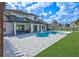 Large backyard featuring a private pool, spa, spacious patio, and well-manicured lawn at 3532 Amaca Cir, Orlando, FL 32837
