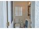 Pool bath features a toilet, vanity, mirror, and window for natural light, conveniently located at 3532 Amaca Cir, Orlando, FL 32837