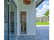Pool bath with tile flooring, toilet, and sliding door to access pool from inside at 3532 Amaca Cir, Orlando, FL 32837