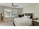 Bedroom featuring ceiling fan, window with blinds, computer desk and white bed set at 3532 Amaca Cir, Orlando, FL 32837
