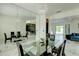 Spacious dining area with marble floors, a mirrored wall, and seating for six at 3532 Amaca Cir, Orlando, FL 32837
