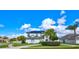 Two-story home with solar panels, a manicured lawn, and lush tropical landscaping at 3532 Amaca Cir, Orlando, FL 32837