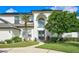 Stunning two-story home featuring mature landscaping, a stone walkway, and an inviting front entrance with a glass door at 3532 Amaca Cir, Orlando, FL 32837