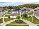 Stunning two-story home with solar panels and a circular driveway surrounded by well-maintained landscaping at 3532 Amaca Cir, Orlando, FL 32837
