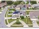 Beautiful two-story home with solar panels, manicured lawn, and circular driveway at 3532 Amaca Cir, Orlando, FL 32837