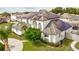 A well-maintained two-story home featuring solar panels, manicured landscaping, and driveway at 3532 Amaca Cir, Orlando, FL 32837