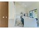 Spacious, modern kitchen with high ceilings, white cabinets, a large island, and upscale appliances for culinary enthusiasts at 3532 Amaca Cir, Orlando, FL 32837