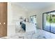 Modern kitchen with marble floors, central island, stainless steel appliances, and access to the pool area at 3532 Amaca Cir, Orlando, FL 32837