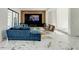 Open-concept living room with modern decor, stylish furniture, and expansive marble flooring at 3532 Amaca Cir, Orlando, FL 32837