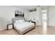 Relaxing main bedroom features hardwood floors and a neutral palette, creating a serene space for rest and rejuvenation at 3532 Amaca Cir, Orlando, FL 32837