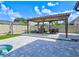 Paver patio with pergola, lounge chairs and dining table, ideal for relaxation and outdoor gatherings at 3532 Amaca Cir, Orlando, FL 32837