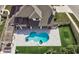 Drone shot of an inground pool with hot tub, outdoor living, and backyard soccer at 3532 Amaca Cir, Orlando, FL 32837