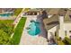An aerial view of a kidney-shaped pool and outdoor entertainment area at 3532 Amaca Cir, Orlando, FL 32837