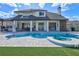 Backyard pool featuring a spa and tiled patio, perfect for summer fun and relaxation at 3532 Amaca Cir, Orlando, FL 32837