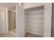 Bright bathroom featuring a glass shower and a spacious walk-in closet at 3565 Dahlia Dr, Lake Hamilton, FL 33851