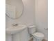 Powder room featuring white pedestal sink and toilet at 3565 Dahlia Dr, Lake Hamilton, FL 33851