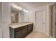 Bathroom with double sink vanity, granite countertop, large mirror, and tile flooring at 3565 Dahlia Dr, Lake Hamilton, FL 33851