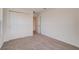 Bright, carpeted bedroom with closet and doorway at 3565 Dahlia Dr, Lake Hamilton, FL 33851